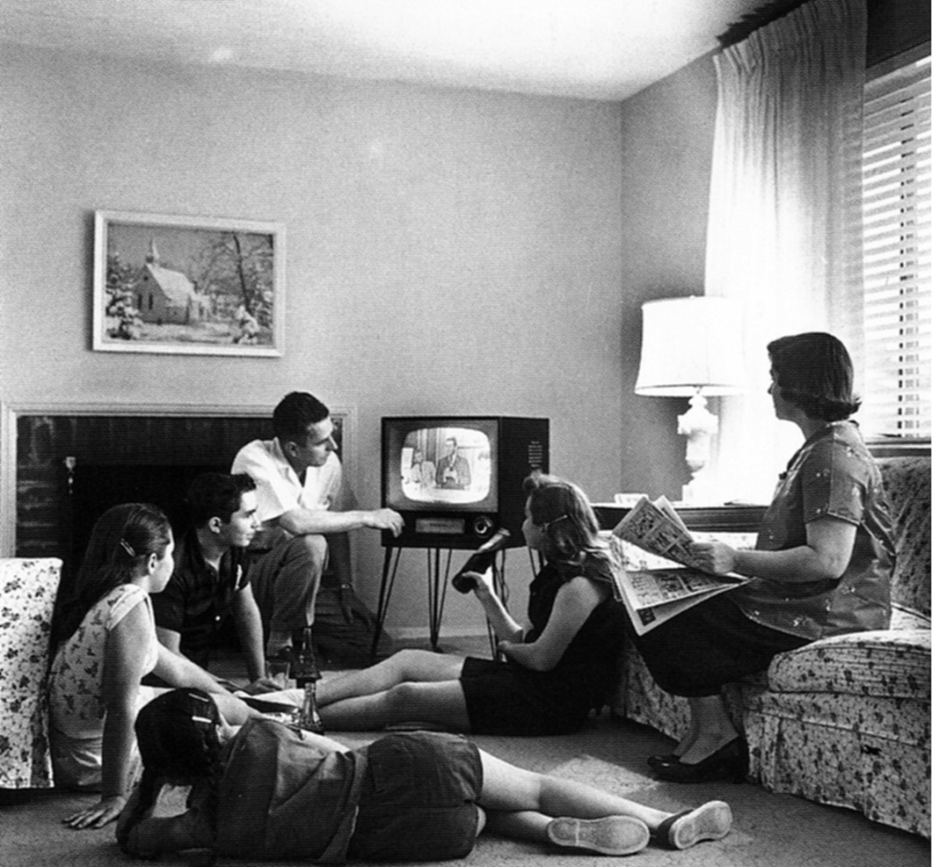 Family watching television, taken by Evert F. Baumgardner, ca. 1958. 