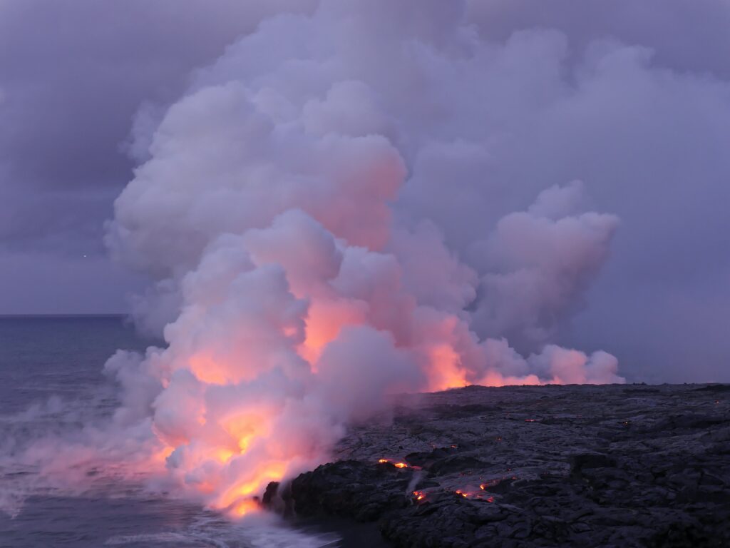 Smokey fire on a coastline at night